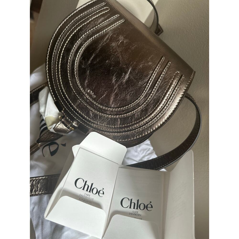 #3 Chloé
Marcie Small Leather Saddle Bag in metallic Gray